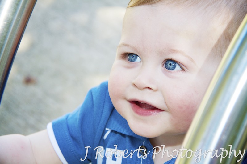 Little boy smiling up at camera - family portrait photography sydney